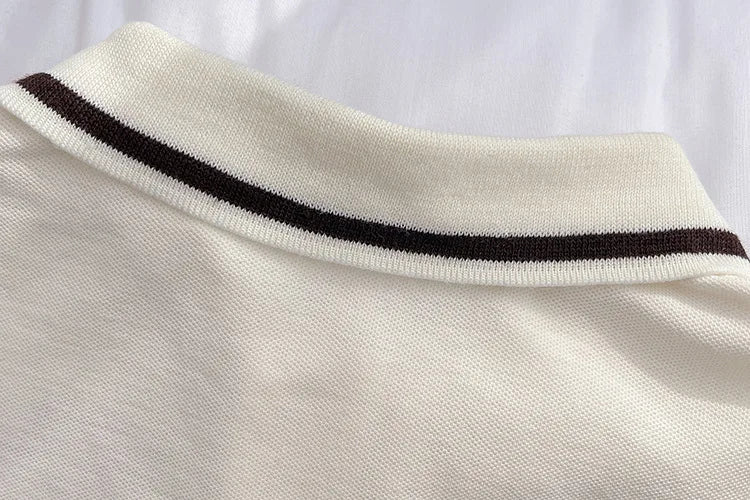 Close-up of white collar with black stripes on Kids Summer Short-sleeve Polo Shirt Bear & Striped Shorts Baby Boy Set