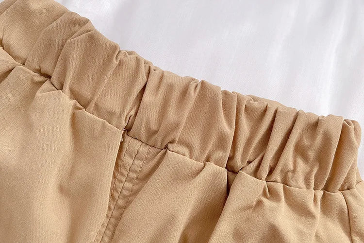 Close-up of elastic waistband on beige shorts from Kids Summer Short-sleeve Polo Shirt Bear & Striped Shorts Baby Boy Set