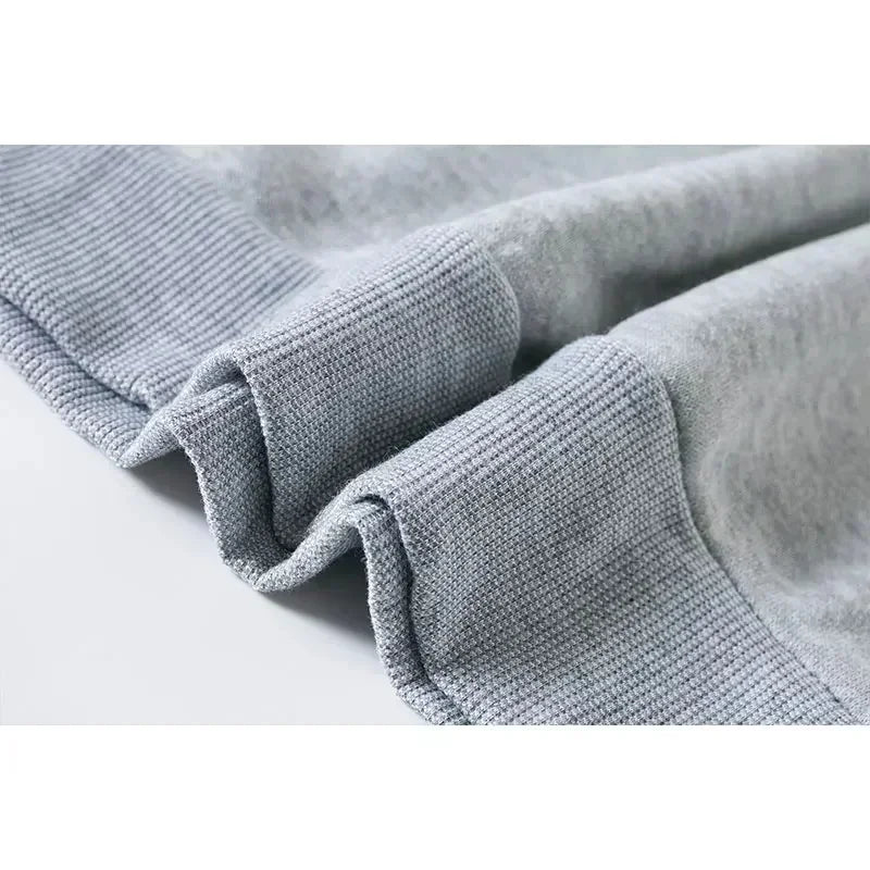Close-up of grey ribbed cuffs on Kids Super Kitties Long Sleeve Sportswear Set fun and affordable outfit