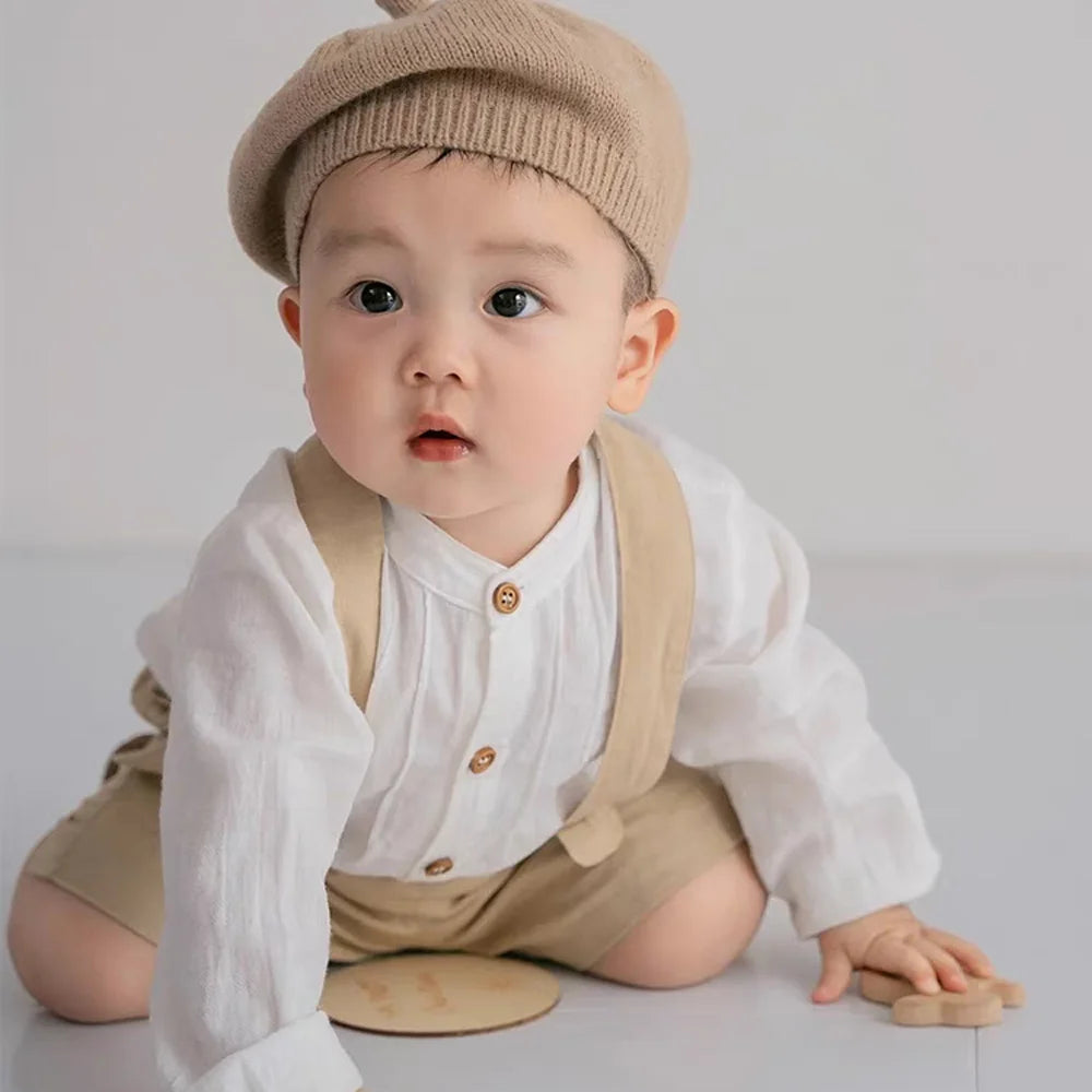 Cute baby boy wearing Boy Outfits Cotton Linen T-shirt & Shorts with suspenders and a beige knit hat