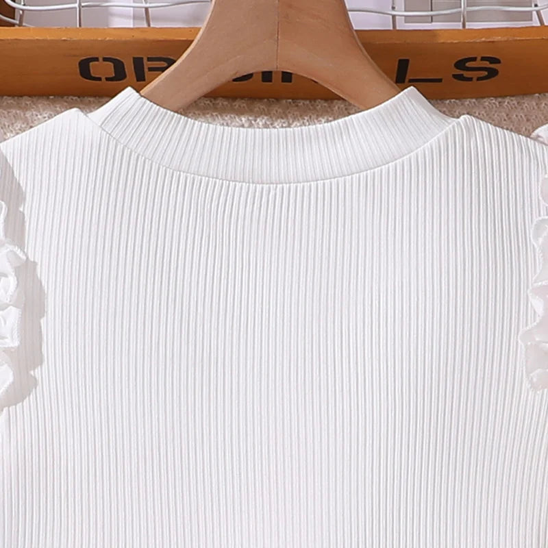 Close-up of Korean Fashion Summer Outfits Kids Girls White Short Sleeve Top Yellow Shorts ribbed fabric and round neckline