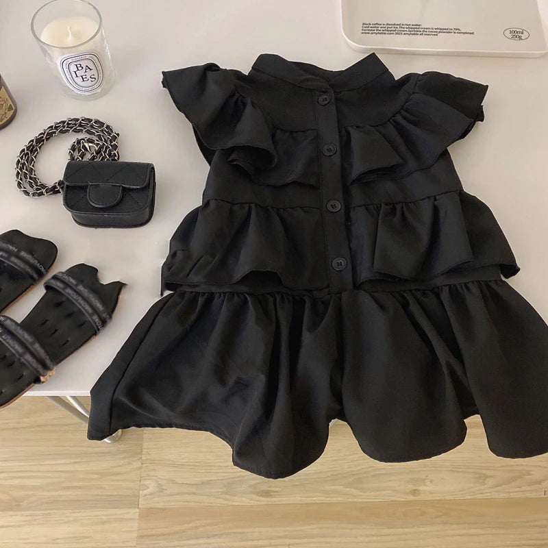 Korean Kids Summer Black Fly Sleeve Layered Dress Girls Fashion Outfit Clothes by Yamza Tots Closet on table with accessories
