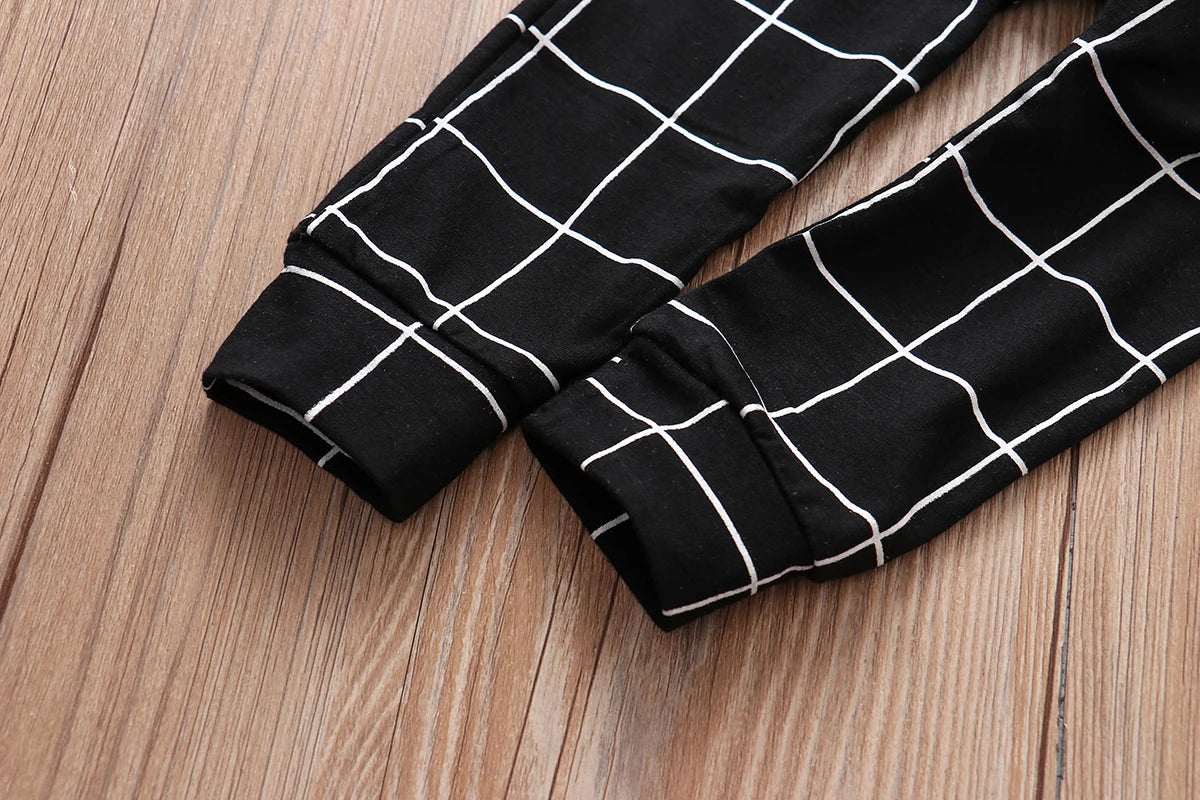 Black lattice trousers with white grid pattern from the LIKE A BOSS Long Sleeve T-Shirt and Lattice Trousers Set for Baby Boys