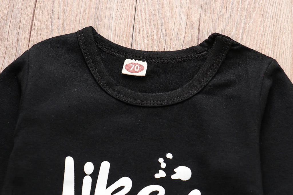 Close-up of a black LIKE A BOSS Long Sleeve T-Shirt and Lattice Trousers Set for Baby Boys by Yamza Tots' Closet