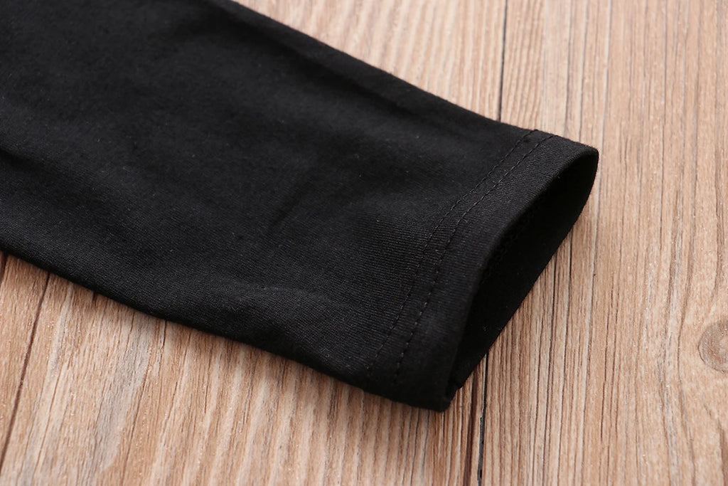 Close-up of black sleeve detail from LIKE A BOSS Long Sleeve T-Shirt and Lattice Trousers Set for Baby Boys