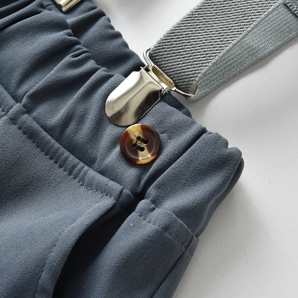 Close-up of button and clip detail on Boys Casual Striped Shirt with Bowtie and Suspender Shorts Two-Piece Outfit