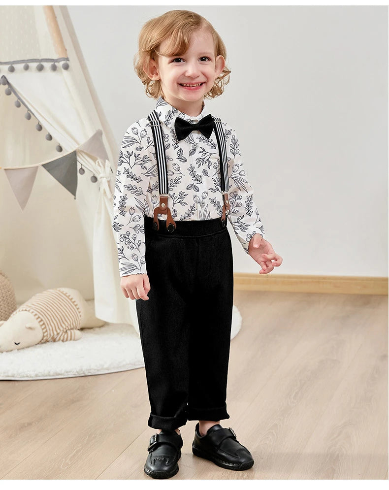 Smiling toddler wearing Children Top And Bottom Clothing Set Vest & Pants in black with suspenders and bow tie