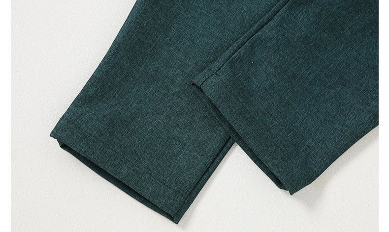Close-up of dark green pants from Children Top And Bottom Clothing Set Vest & Pants by Yamza Tots' Closet