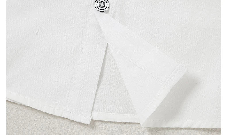 Close-up detail of white fabric with button showcasing Children Top And Bottom Clothing Set Vest & Pants