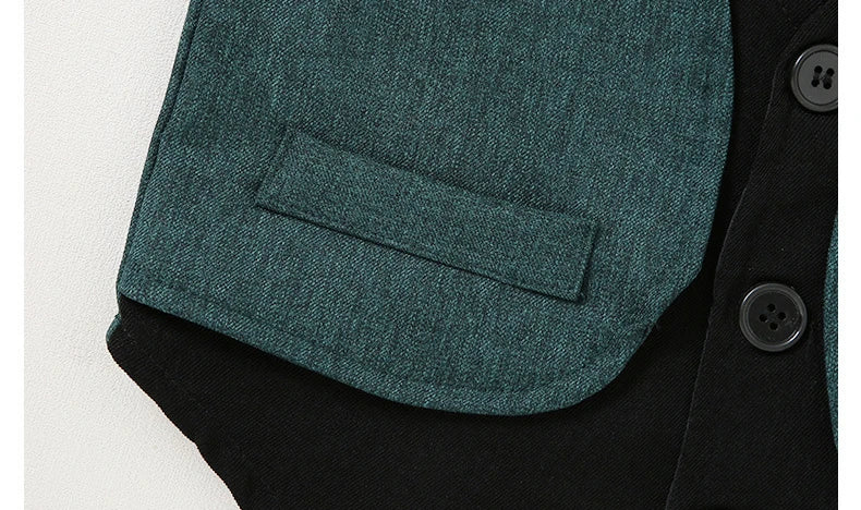 Close-up of green vest pocket on black fabric from Children Top And Bottom Clothing Set Vest & Pants by Yamza Tots' Closet
