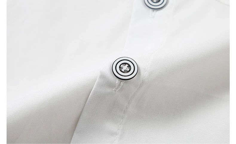 Close-up of buttons on white Children Top And Bottom Clothing Set Vest & Pants from Yamza Tots' Closet
