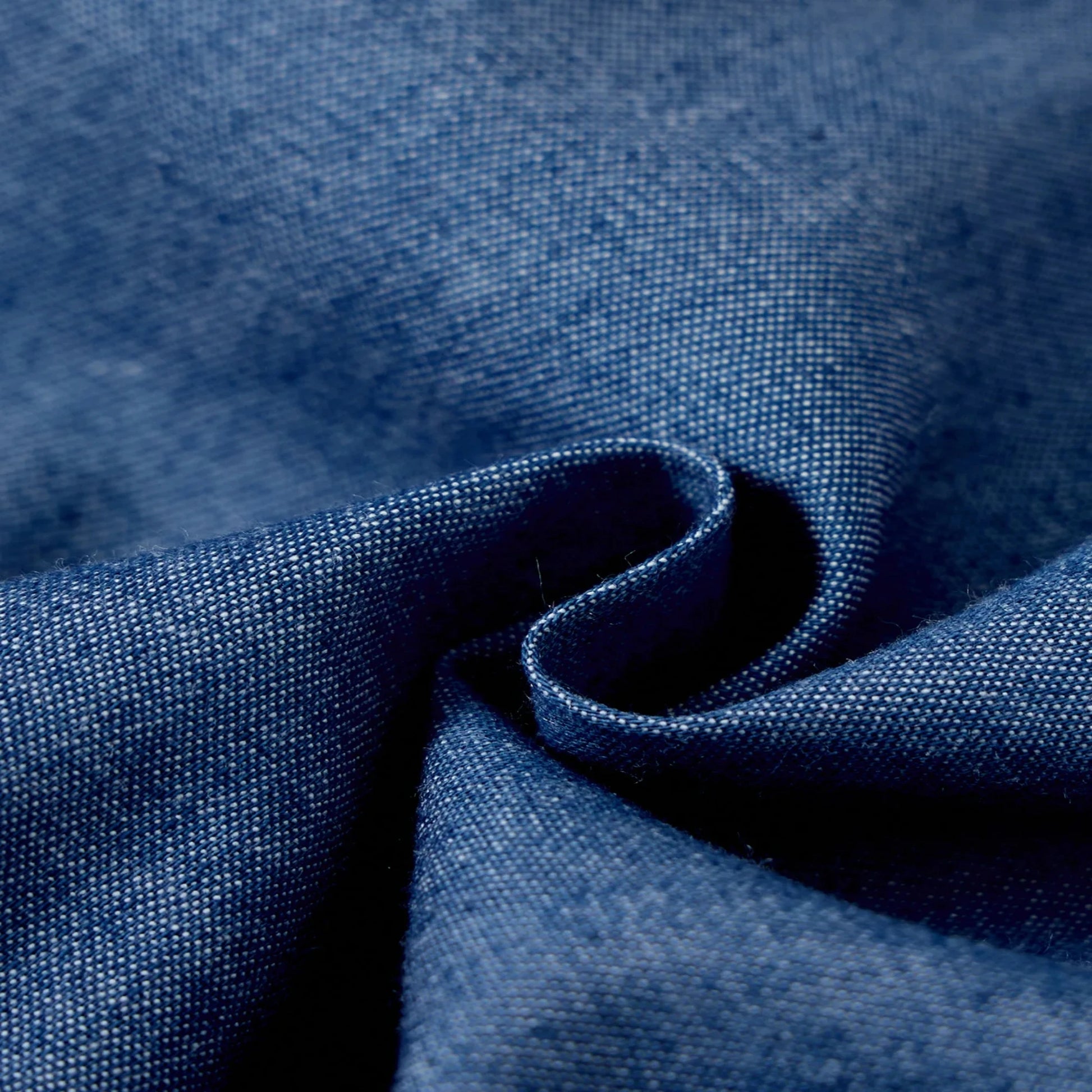 Close-up of blue denim fabric used in Fashion Girls Dress Summer Casual Patchwork Cowboy Butterfly Floral Design