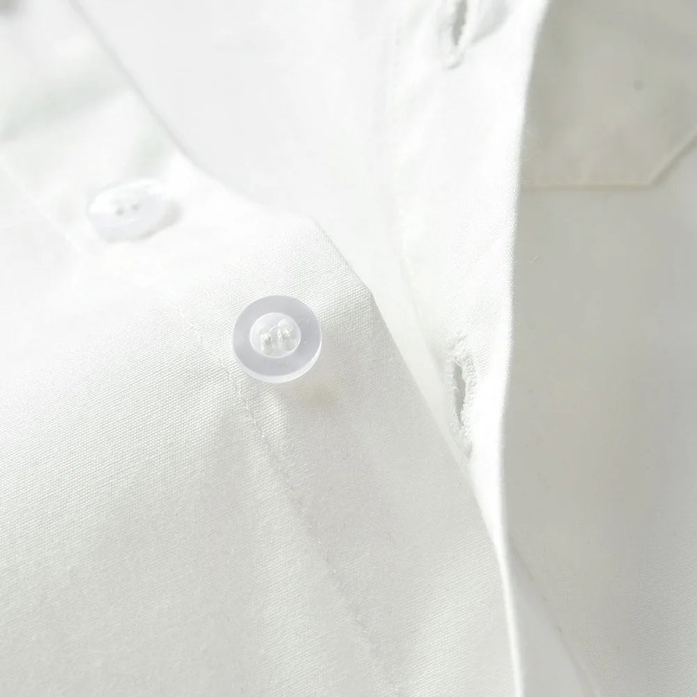 Close-up of a white button on Baby Boy 3PCS Outfit Set Bow Shirt Vest and Pants Suit for 0-7 Years