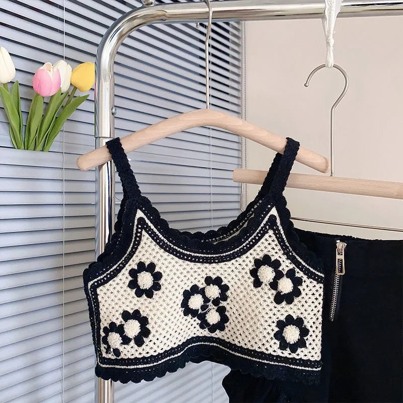 Fashion Baby Girl Knitted Set Strap Flower Vest and Shorts 2PCS Summer Suit in black and white hanging on wooden hanger
