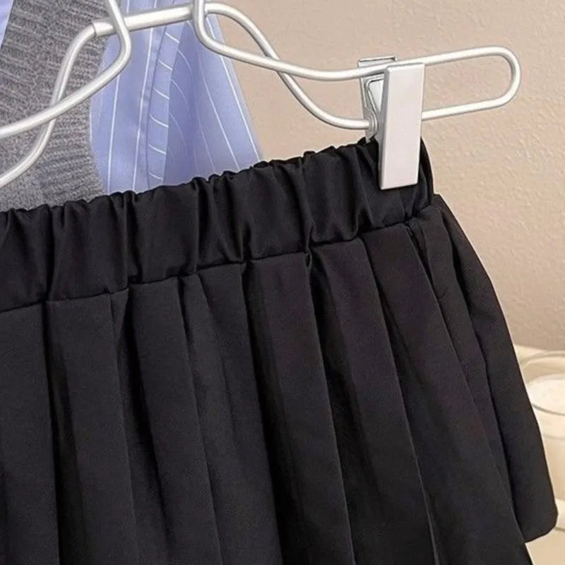 Close-up of black pleated skirt from Fashion Baby Girl Set Shirt Vest and Pleated Skirt Toddler Outfit 2PCS by Yamza Tots' Closet