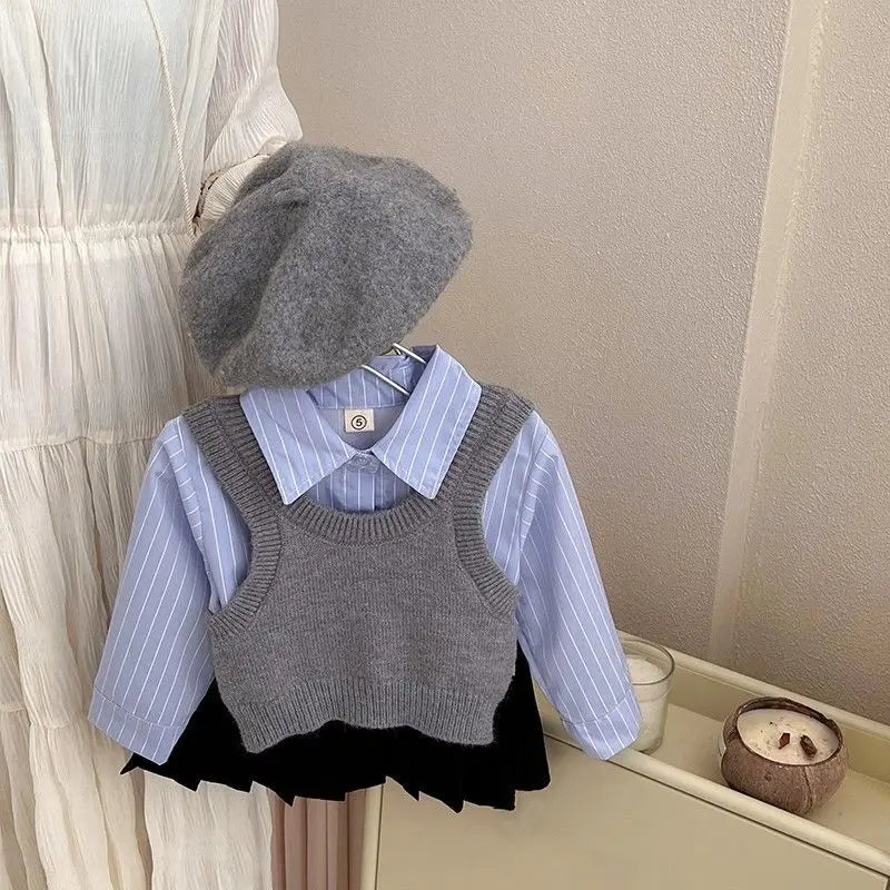 Fashion Baby Girl Set Shirt Vest and Pleated Skirt Toddler Outfit 2PCS displayed with gray knit vest blue striped shirt and black skirt