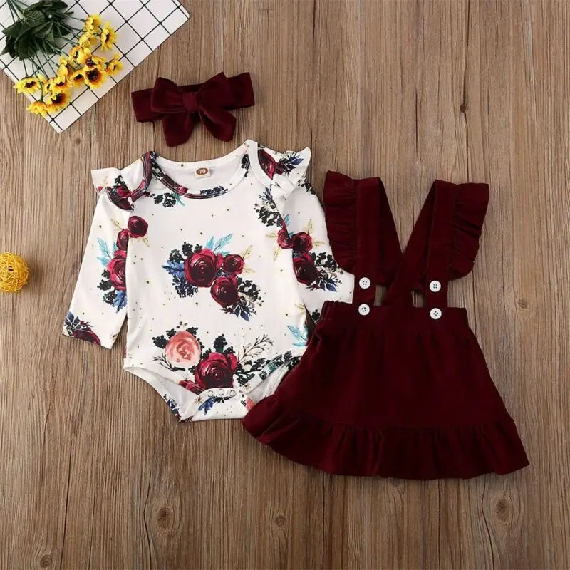Newborn Baby Girl Floral Bodysuit Set with Suspender Skirt and Bow Headband in burgundy and floral print  