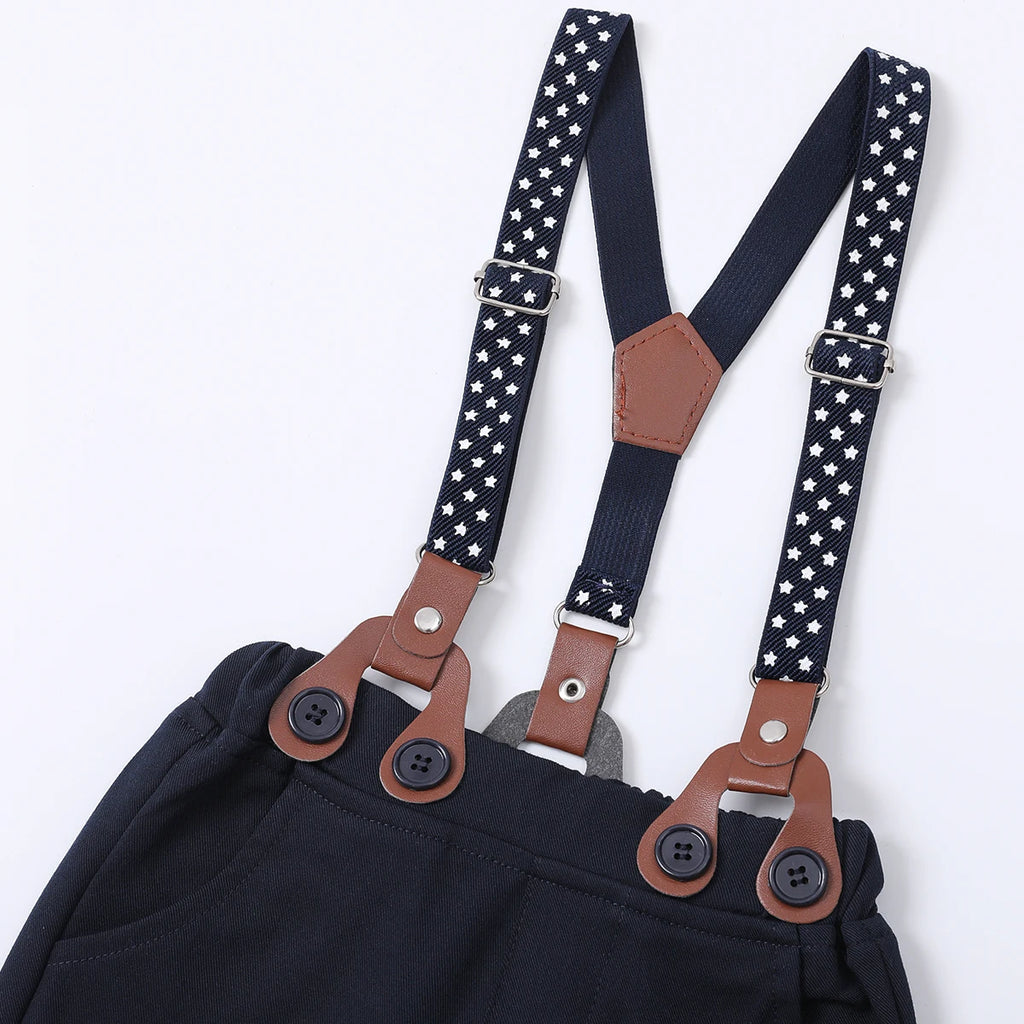 Navy blue baby pants with star-patterned suspenders and leather accents for stylish toddler outfits.