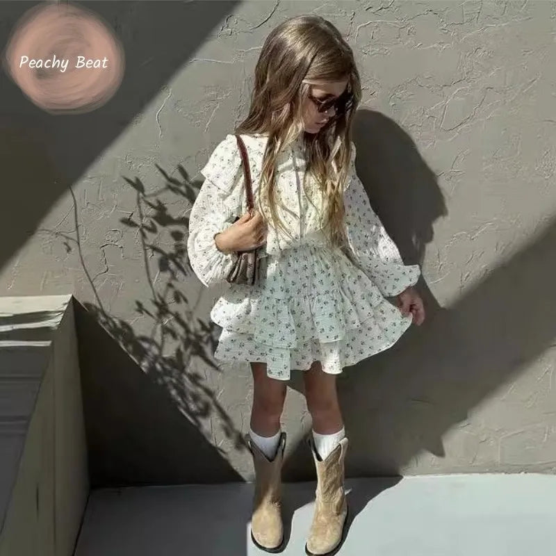 Fashion Baby Girl Clothes Set Floral Blouse and Layered Skirt 2PCS Outfit worn by toddler with sunglasses and boots
