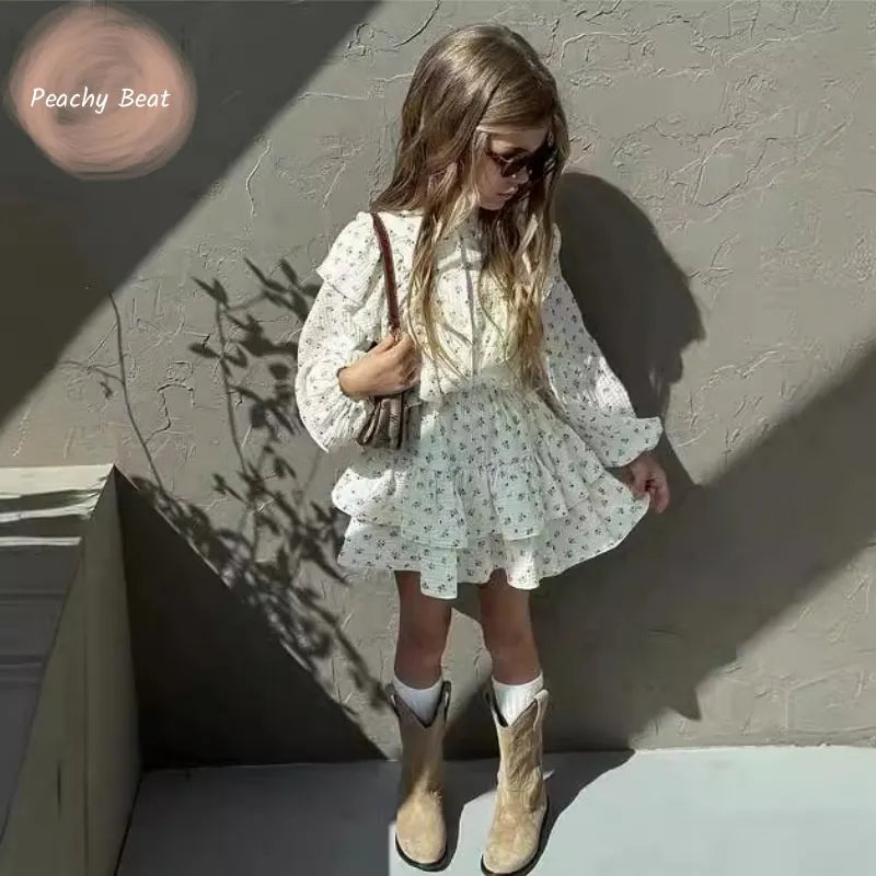 Fashion Baby Girl Clothes Set Floral Blouse and Layered Skirt 2PCS Outfit worn by child with boots and sunglasses