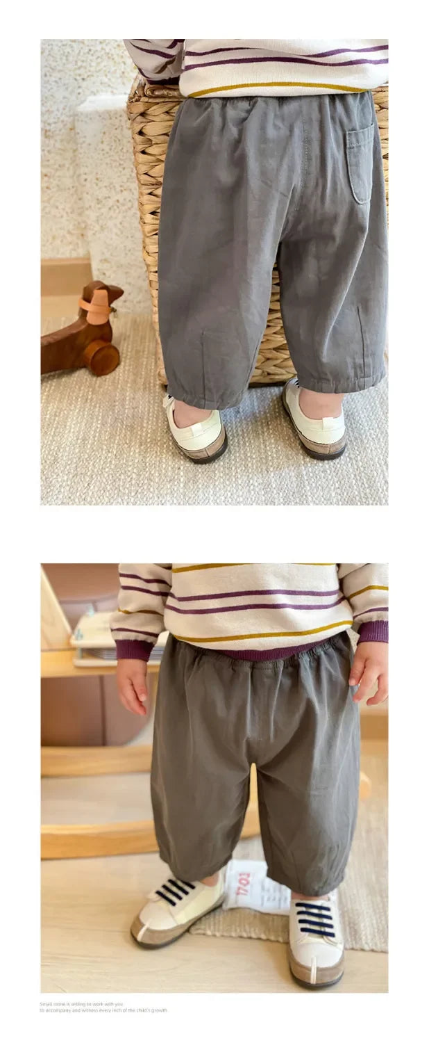 Solid Kids Fashion Trousers Casual Loose Pocket Ankle Length Pant for Boys Girls in gray worn by child