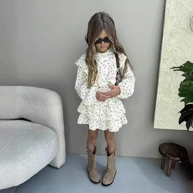 Fashion Baby Girl Clothes Set Floral Blouse and Layered Skirt 2PCS Outfit worn by toddler with sunglasses and boots indoors