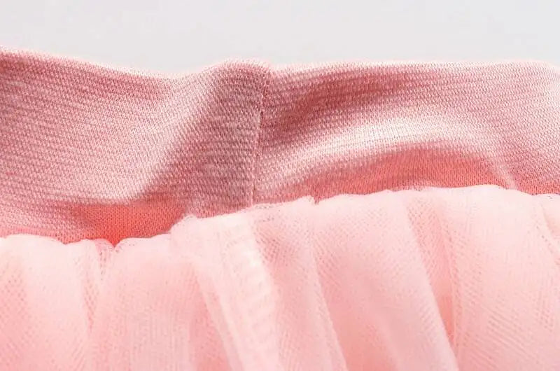 Close-up of pink tulle tutu skirt and soft cotton waistband in Girls Summer Dress Set Cute Stitch T-Shirt and Tulle Tutu Skirt Outfit