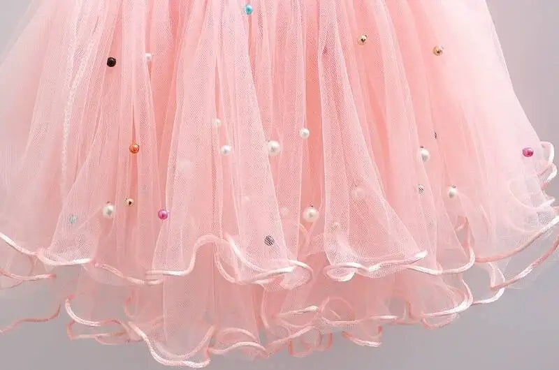 Close-up of pink tulle tutu skirt with colorful beads from Girls Summer Dress Set Cute Stitch T-Shirt and Tulle Tutu Skirt Outfit