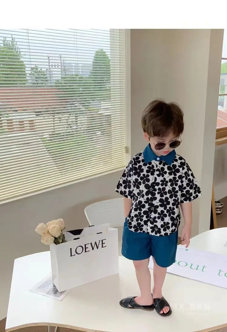 Stylish Flower Suit for Children Baby Short Sleeve Shirt and Casual Shorts Set worn by toddler indoors with sunglasses