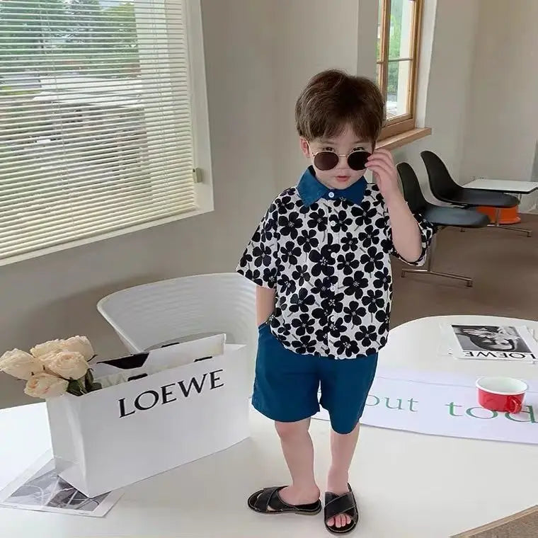 Stylish Flower Suit for Children Baby Short Sleeve Shirt and Casual Shorts Set worn by toddler with sunglasses indoors