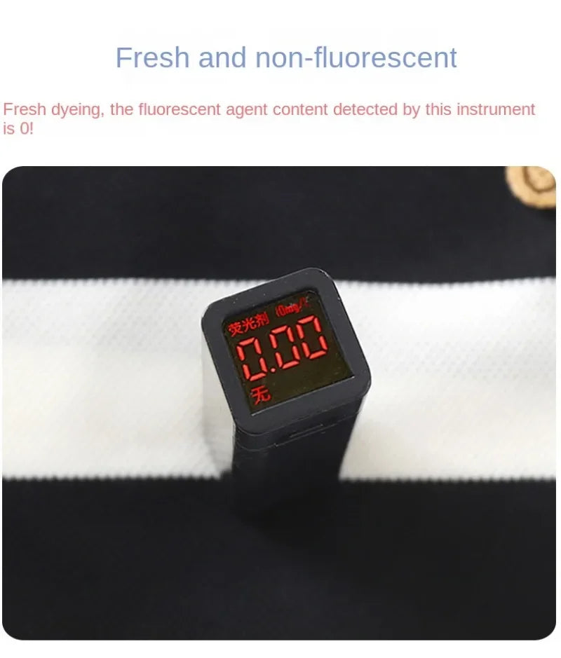 Close-up of a device measuring non-fluorescent content on black and white striped fabric for Summer Kids Sets Boys Girls Short Sleeve Striped T-shirt and Shorts Tracksuit