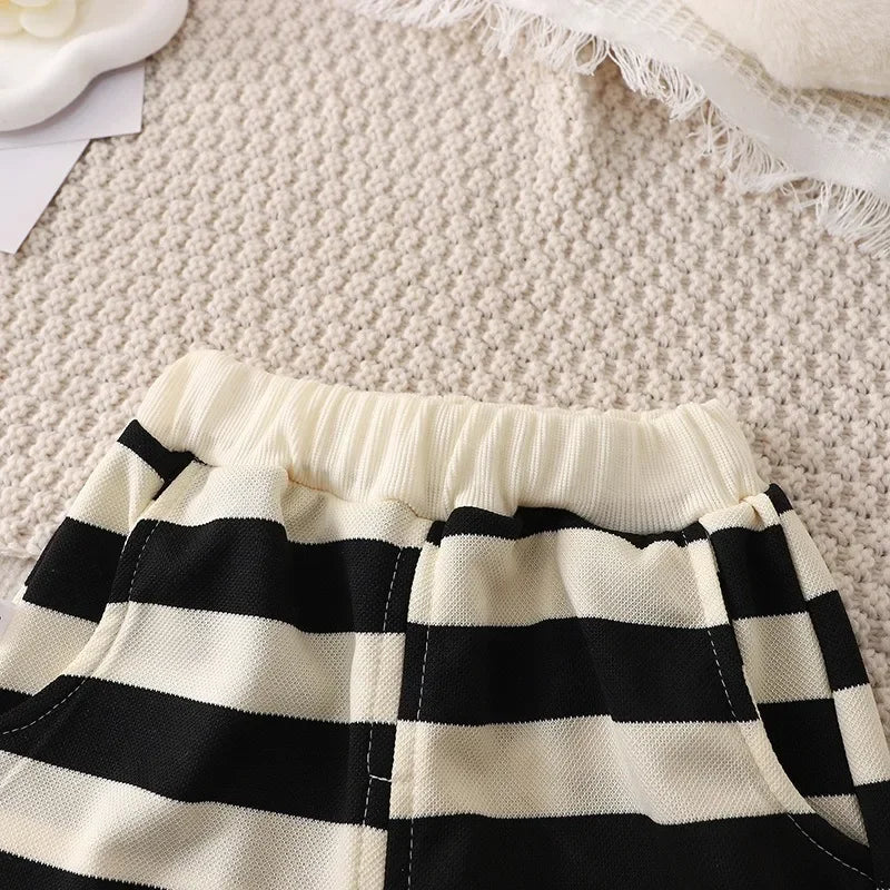 Close-up of black and white striped shorts from Summer Kids Sets Boys Girls Short Sleeve Striped T-shirt and Shorts Tracksuit by Yamza Tots' Closet