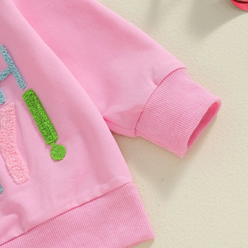 Close-up of pink sweatshirt sleeve with textured colorful embroidery from Sweatshirt Rainbow & Tulle Skirt