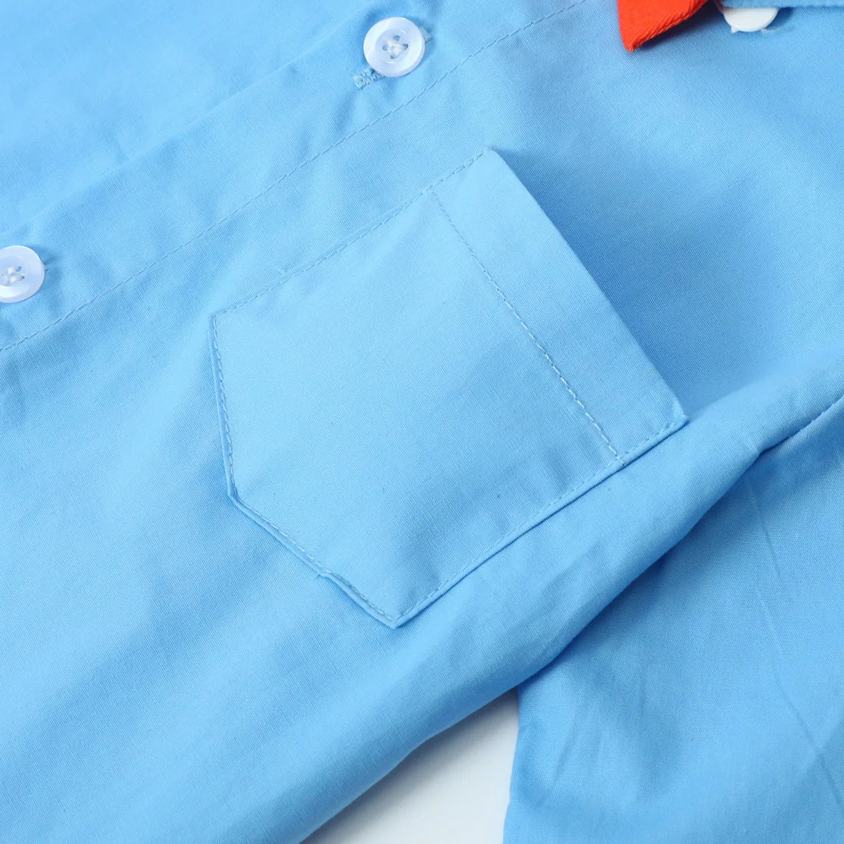 Close-up of light blue toddler boy outfits baby Halloween costume with buttons and pocket