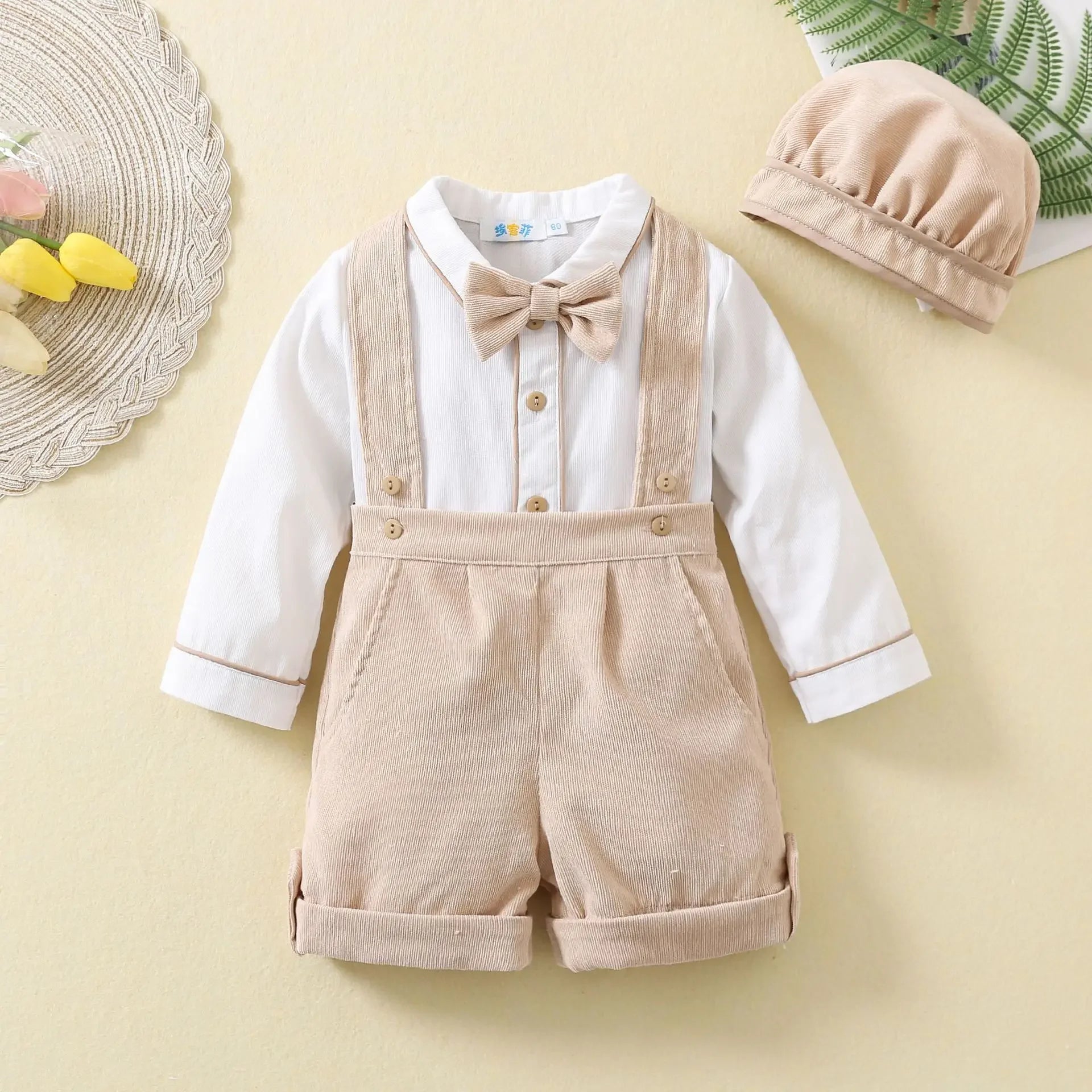 Toddler boys birthday outfit with white shirt bow tie beige shorts suspenders and matching hat