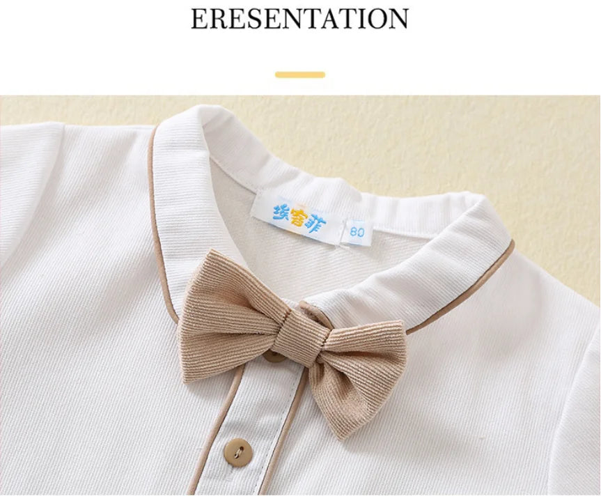Close-up of toddler boys birthday outfit white shirt with beige bow tie and buttons from Yamza Tots' Closet