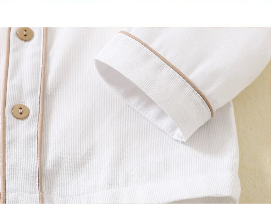 Close-up of white toddler boys birthday outfit shirt with brown buttons and trim from Yamza Tots' Closet