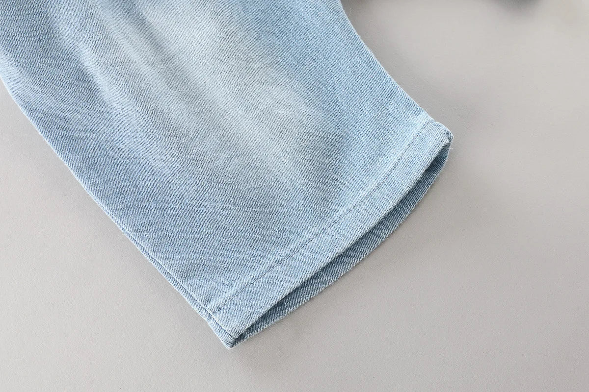 Close-up of denim shorts hem from Toddler Boys Fashion Outfit Set Printed T-Shirt Cartoon Bag Denim Shorts