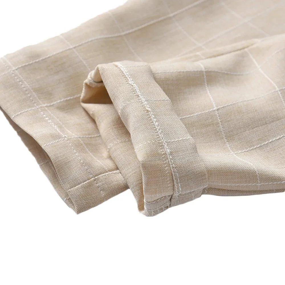 Close-up of beige pants with subtle white check pattern from Toddler Boys Formal Outfit Striped Vest White Shirt and Pants Wedding Suit