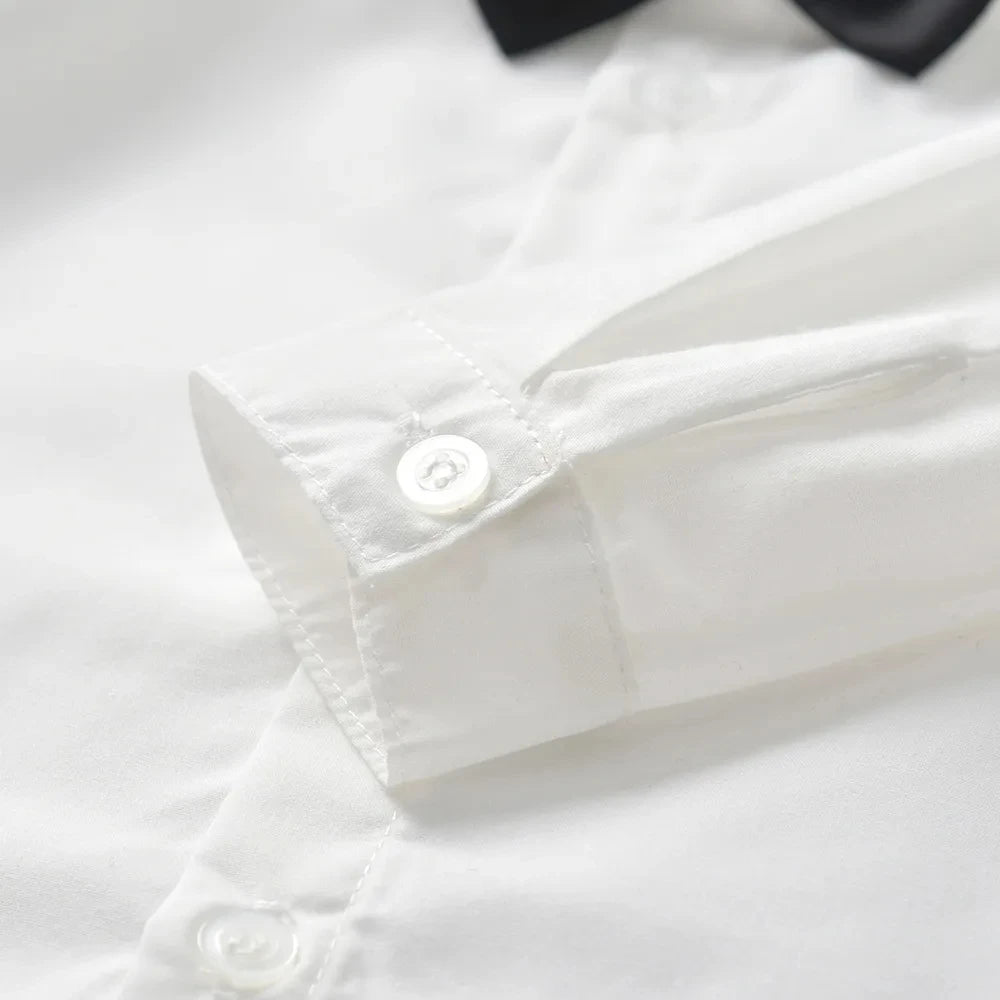 Close-up of white shirt cuff with button from Toddler Boys Formal Outfit Striped Vest White Shirt and Pants Wedding Suit