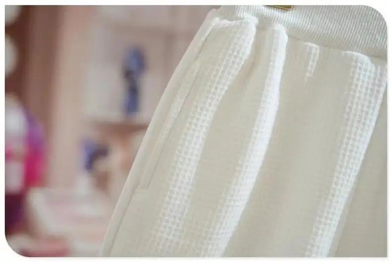 Close-up of white textured fabric from Kids Girls Spring Autumn Blouse Top and Pants Set Sweet Casual Outfit Set