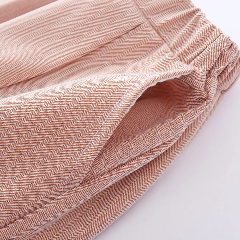 Close-up of kids pink boys 3-piece vest suit with tie bow and hat birthday dress set pants pocket with herringbone pattern