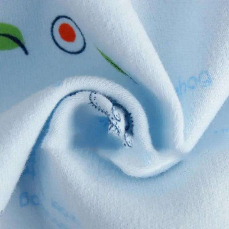 Close-up of soft blue fabric from Newborn Baby Pure Cotton Clothing Set with Top Pants Hat Bibs Cartoon Print
