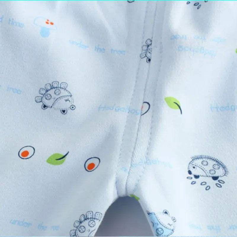 Close-up of Newborn Baby Pure Cotton Clothing Set with Top Pants Hat Bibs Cartoon Print featuring cute animal and leaf designs