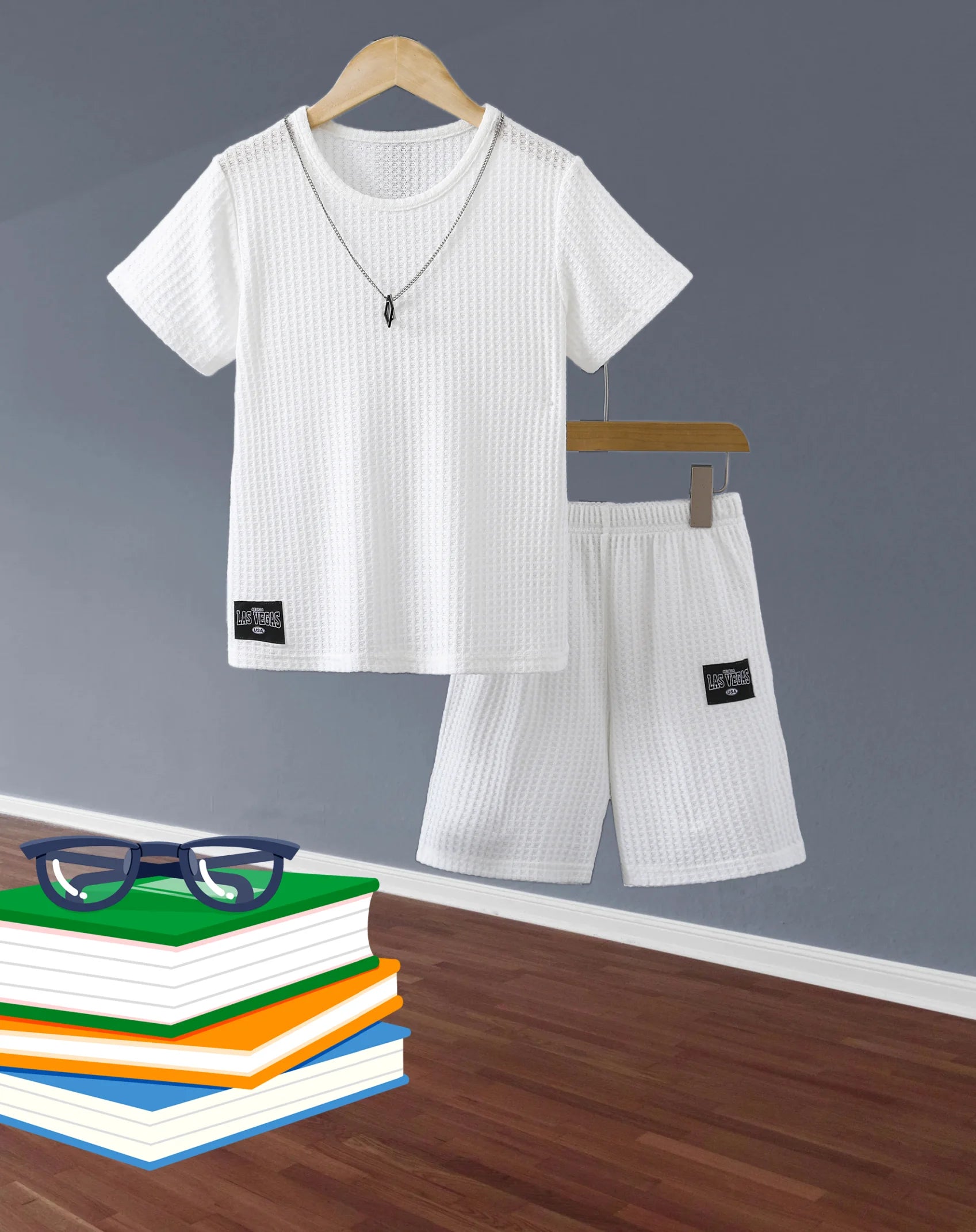 Stylish Boys Outfit Set Trendy Short Sleeve Shirt and Shorts Summer Design in white waffle fabric hanging on wooden hangers 