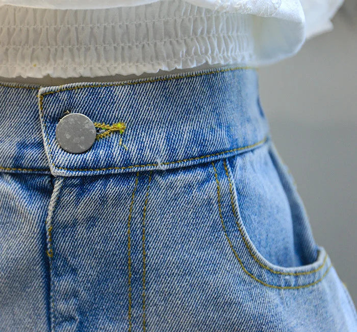 Close-up of blue denim jeans detail with button and stitching from Summer New Girls Clothing Fashion Suit by Yamza Tots' Closet
