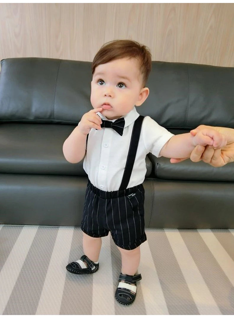 Toddler boy wearing Toddler Boy Birthday Outfit Summer Formal Shirt and Shorts Clothing Set with bow tie and suspenders