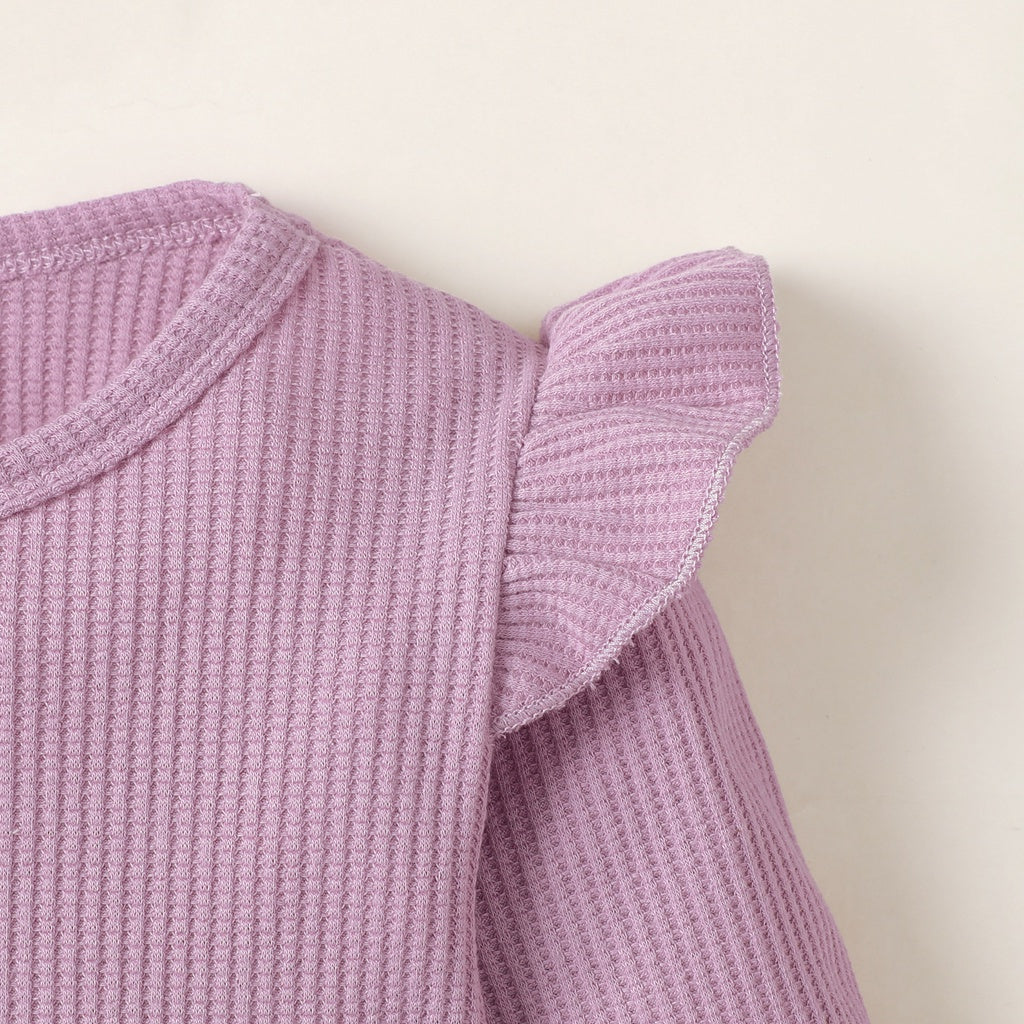 Close-up of lavender toddler girl clothes set long sleeve solid top with ruffle shoulder detail