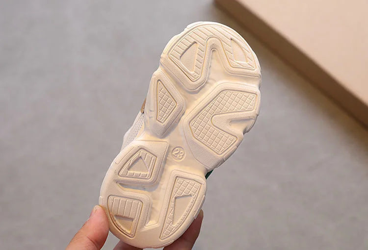 Breathable Mesh Kids Casual Sneakers Non-Slip Sport Shoes for Boys and Girls showing sole grip pattern