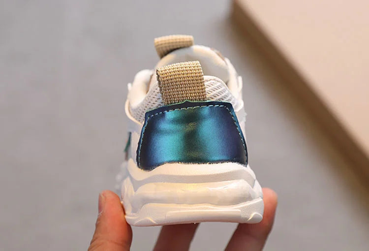 Breathable Mesh Kids Casual Sneakers Non-Slip Sport Shoes for Boys and Girls in white blue design held in hand